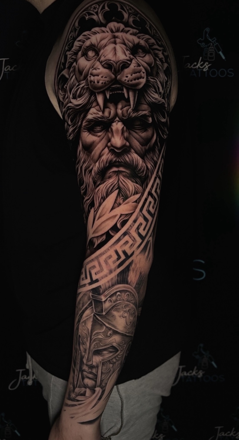 Black and grey Greek god and lion full arm sleeve tattoo