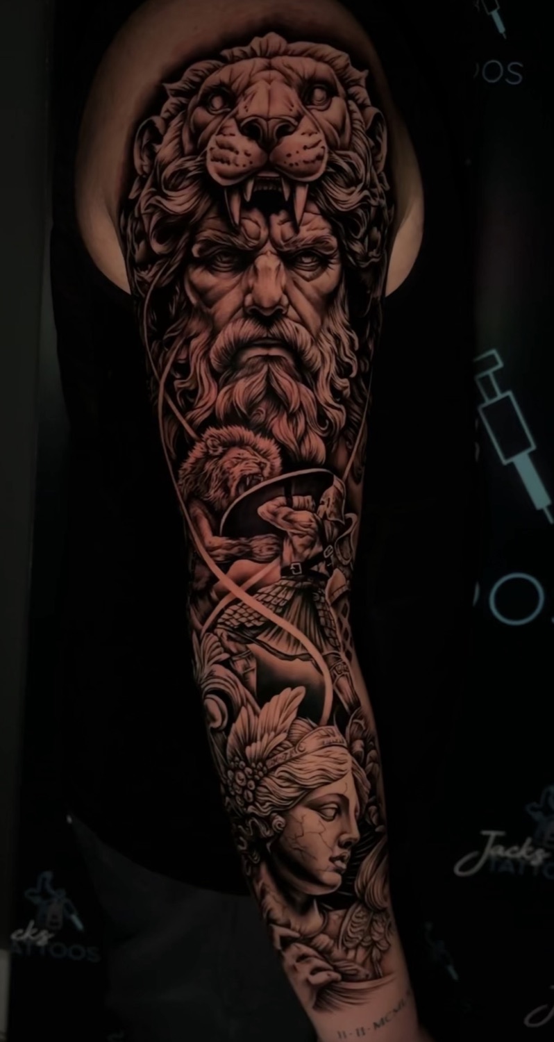 Black and grey Greek god and lion sleeve tattoo, inner arm view