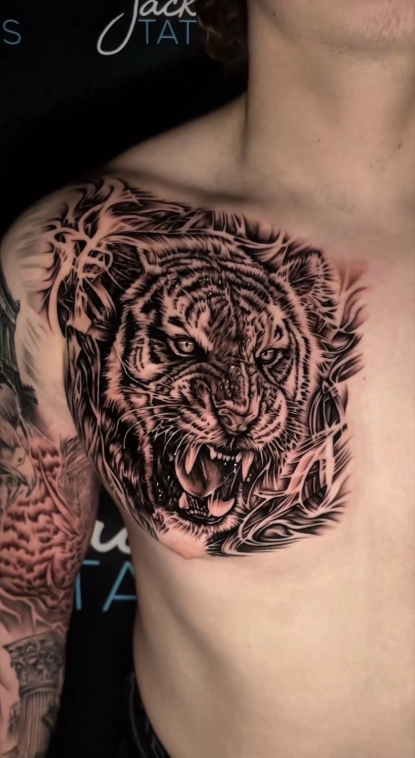 Black and grey roaring tiger chest tattoo