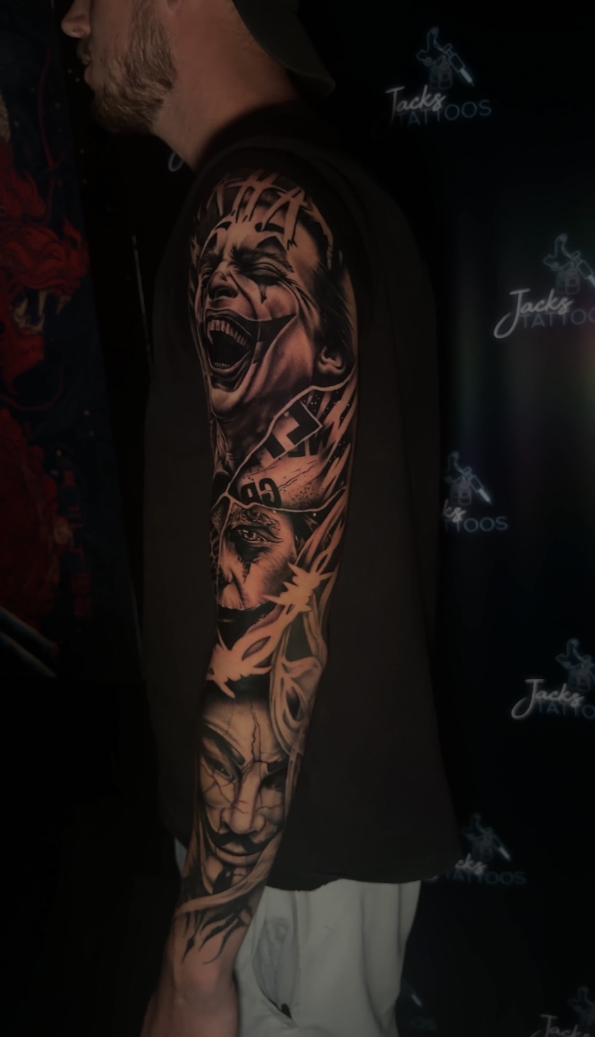 Black and grey horror portrait full arm sleeve tattoo