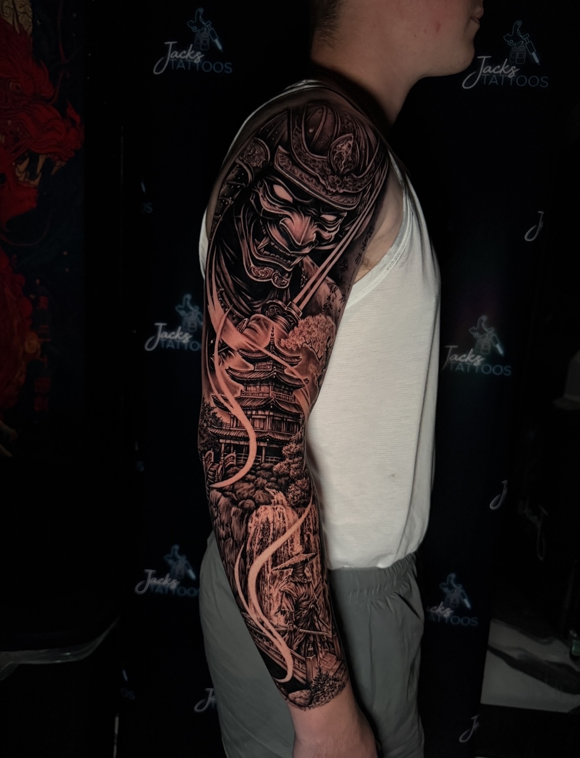 Black and grey samurai warrior full arm sleeve tattoo