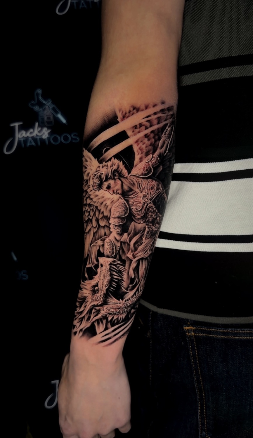 Black and grey archangel warrior forearm tattoo