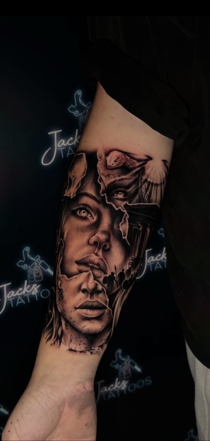 Black and grey woman portrait in torn skin forearm tattoo