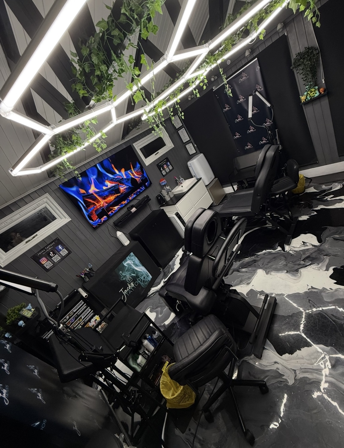 The Jacks Tattoos studio from the doorway, with chairs and workstations